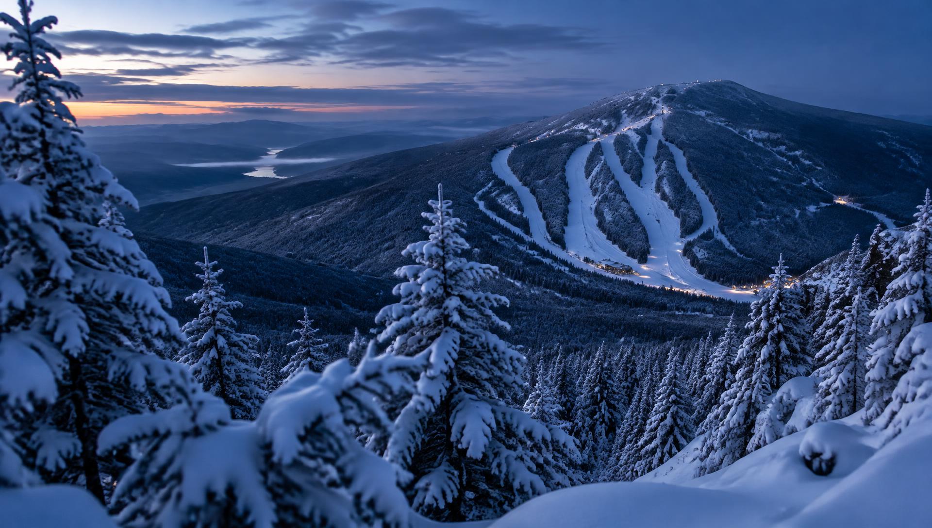 Snow-covered Vermont ski mountain at dusk